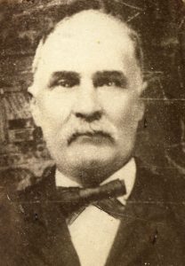 Anson LaPorte as an older man, with a white mustache.