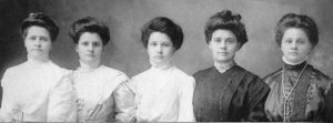 Five young women in their best dresses.